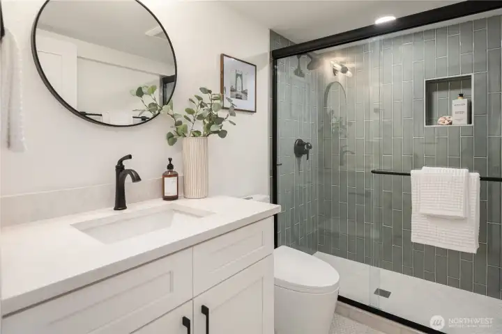 The basement bedroom also features extensive tile work and designer finishes.