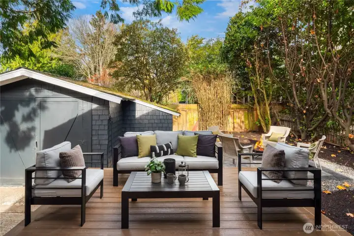 Just off the french doors is this new composite deck and a paver patio just beyond.