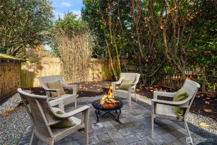 The paver patio and entire backyard is surrounded by natural greenery that makes this a private oasis.