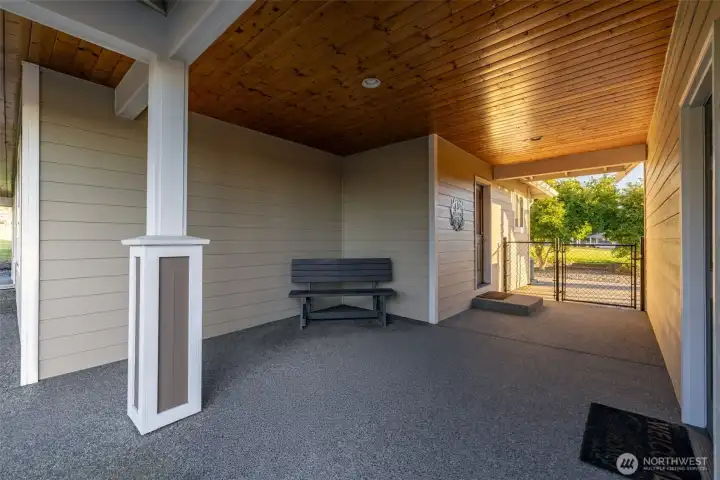 Covered breezeway connects main home to garage. Side entry to utility room from garage offers great functionality.