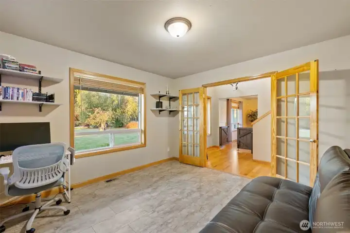 Flexible main floor space for office, den or hobbyist.