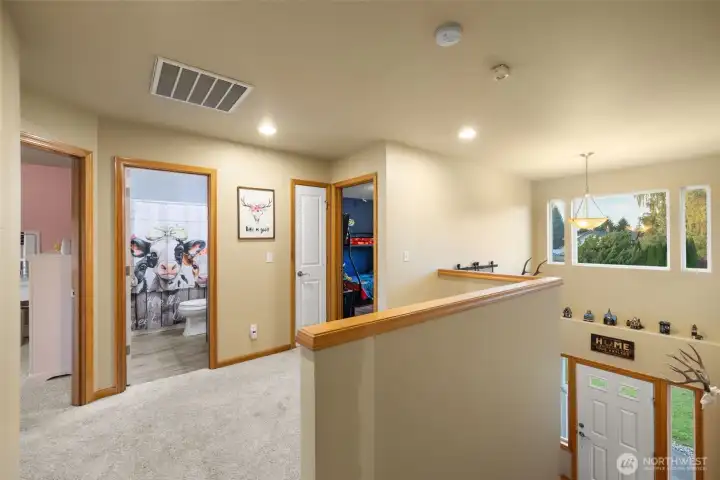 Upstairs landing leads to bedrooms.