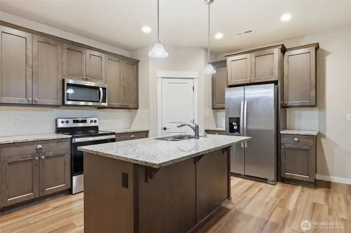 Open kitchen space with pantry.