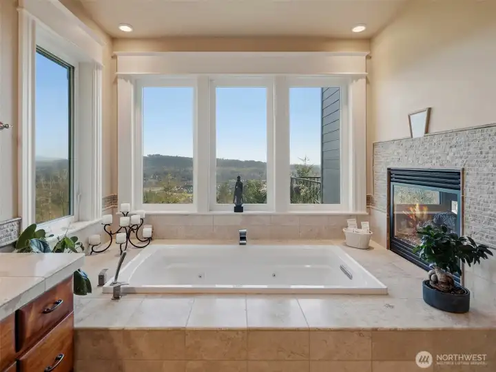 Soaking tub with 2-sided firepalce