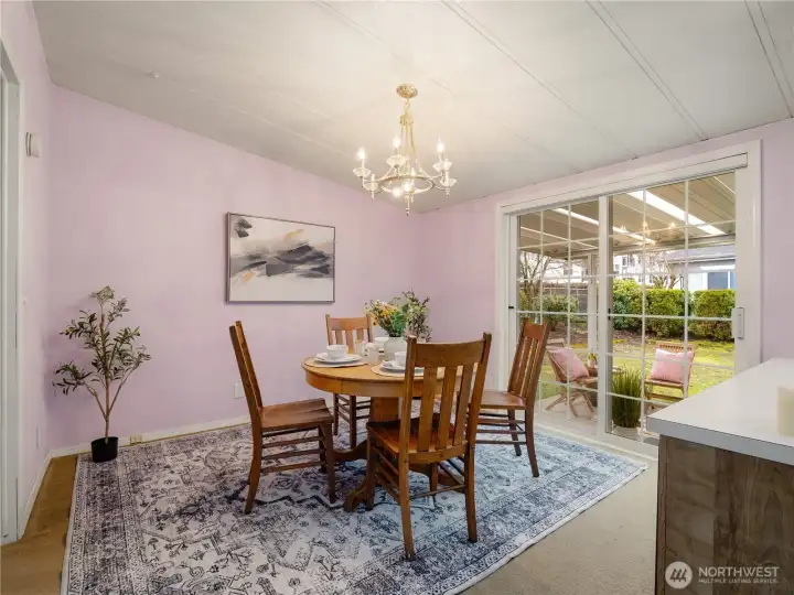 Step outside tot the covered patio directly from the dining room.