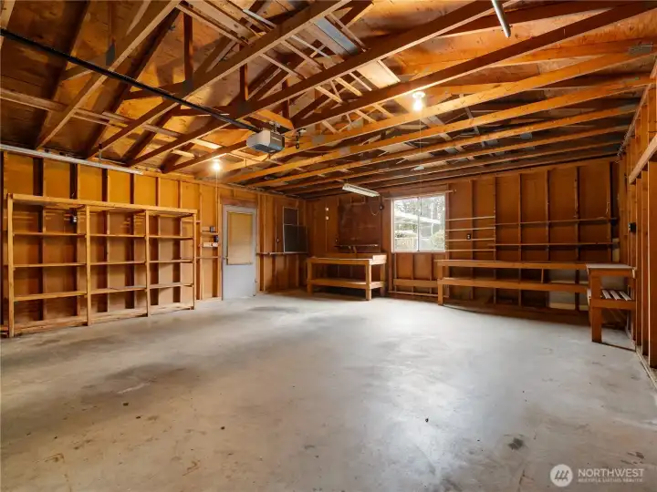 Storage in the rafters, storage on the shelves, and still room for two cars and workshop space.