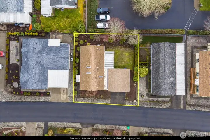 Aerial view with boundary lines for illustrative purposes only. The large side yard is highlighted here.