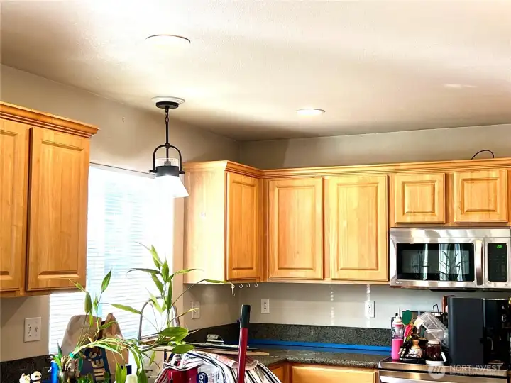 Kitchen is open concept with a peninsula for bar stools