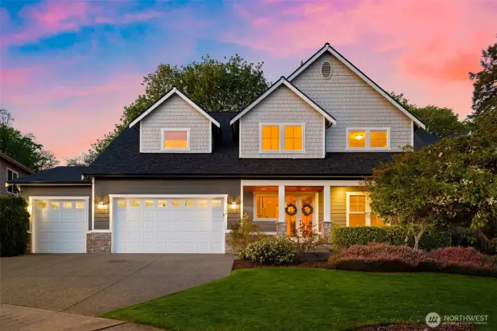 Front of home with 3 car garage and expansive driveway for parking
