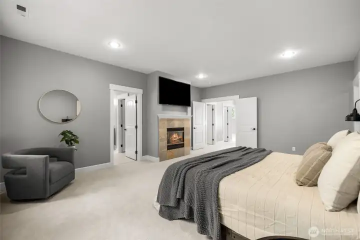 Primary Bedroom with gas fireplace, attached en suite bath