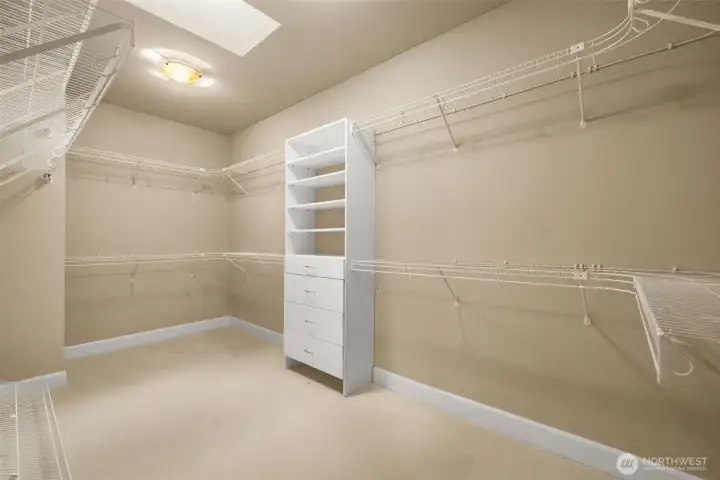 MASSIVE primary bedroom walk-in closet. This space offers ample storage and organization, perfect for showcasing your wardrobe and accessories.