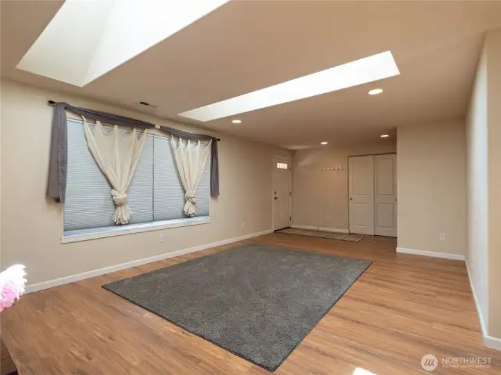 Living room with the skylights that flood the room with natural light.