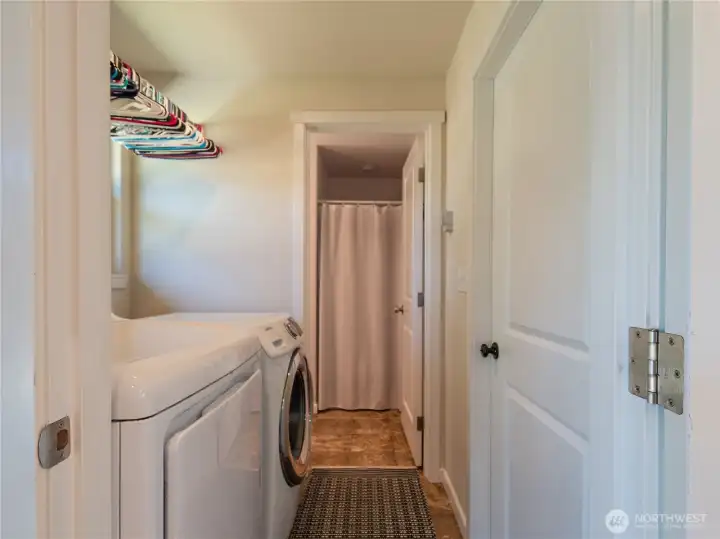 Utility room with entrance to the 2nd bath & the door to the attached garage is on the right.