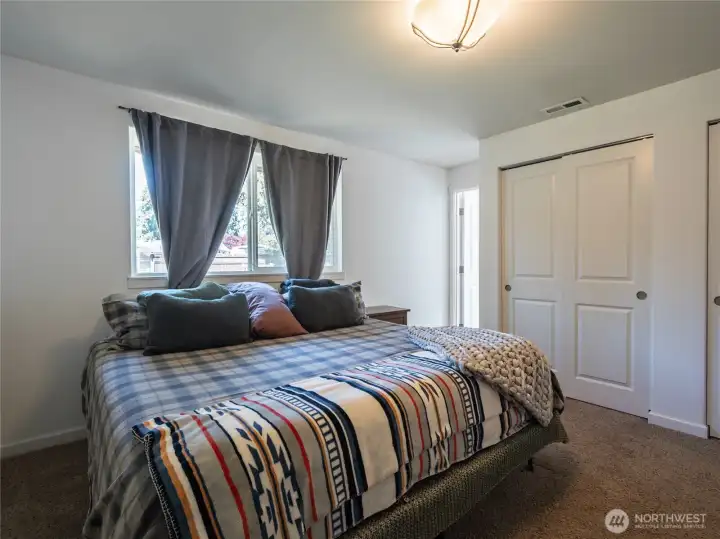 Spacious Primary bedroom has private entrance to dual-access bathroom.