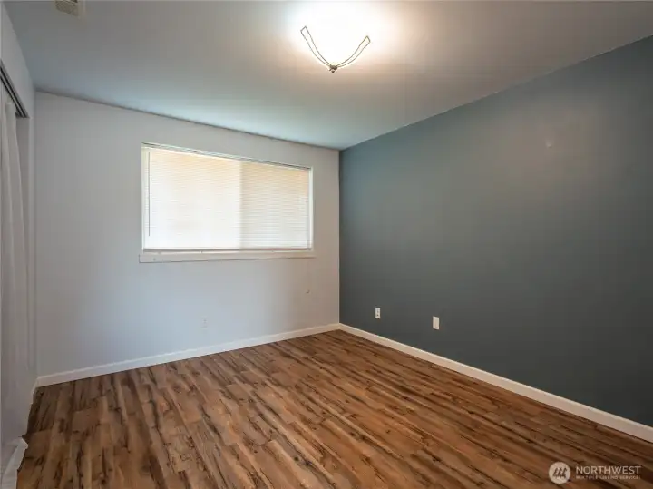 2nd bedroom with beautiful flooring.