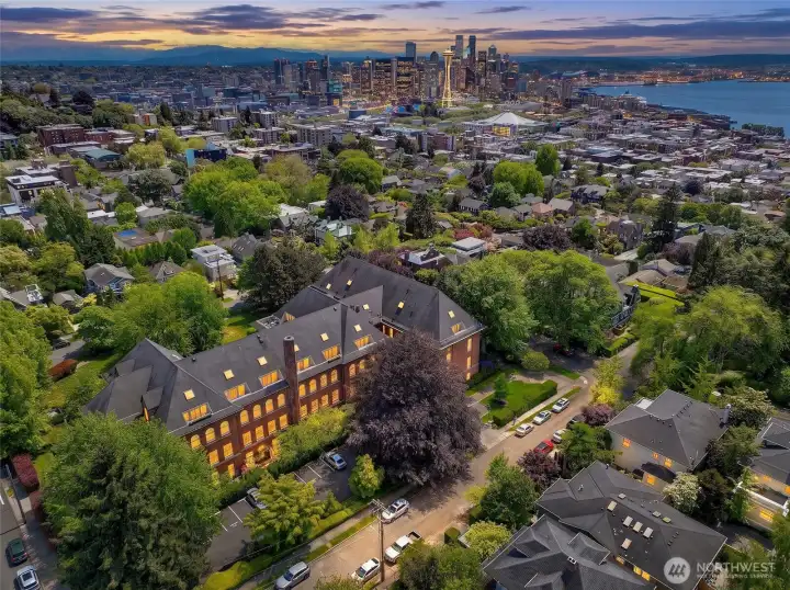 Historic Height. Modern Ease. Residence #306 occupies a remarkable loft home within the landmark West Queen Anne School, where nineteenth-century architecture has been thoughtfully reimagined for contemporary living.
