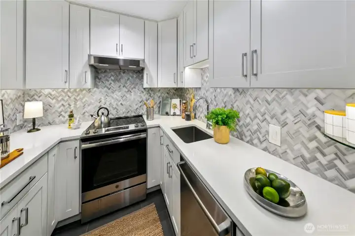 Thoughtfully updated kitchen finishes balance contemporary convenience with the home's historic character and architectural authenticity.