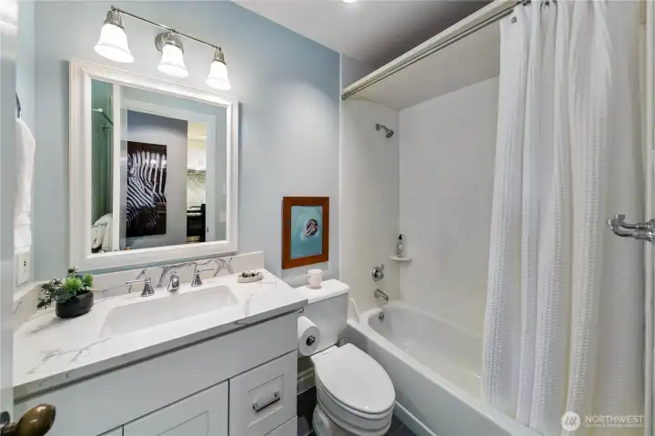 Bright and functional bath spaces provide modern convenience within a residence defined by historic character.