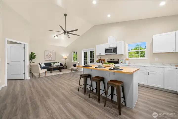 The great room features the eat-in kitchen and living room.