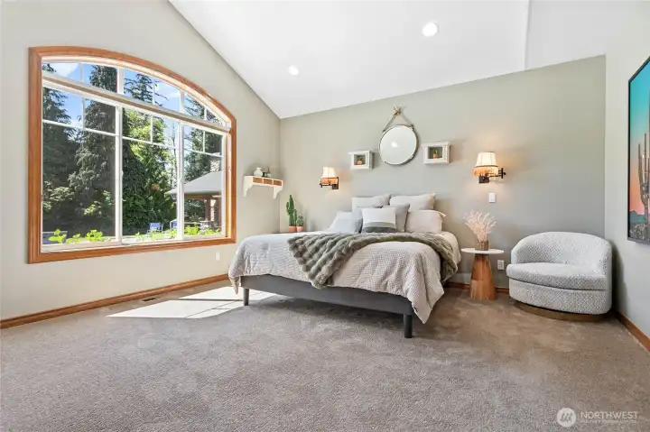 Spacious main-floor primary suite with private access to the patio Spacious main-floor primary suite with private access to the patio
