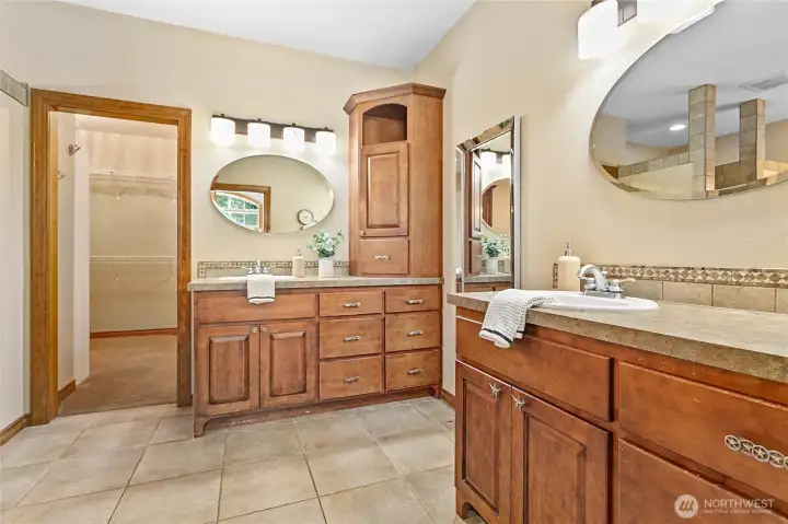 a luxurious ensuite bath with separate sinks, separate walk-in shower and tub a luxurious ensuite bath with separate sinks, separate walk-in shower and tub