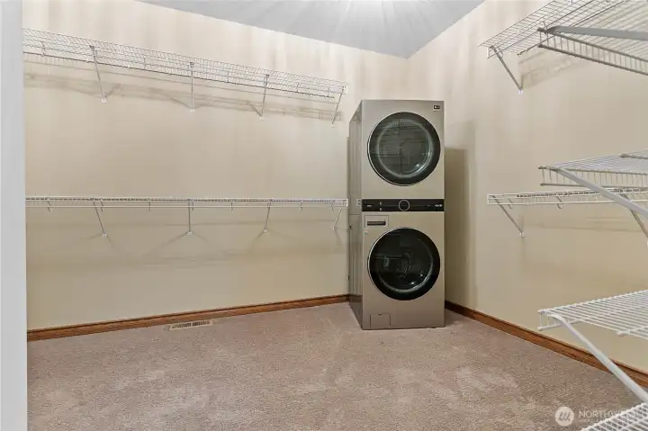 oversized walk-in closet complete with its own washer and dryer for added convenience. oversized walk-in closet complete with its own washer and dryer for added convenience.