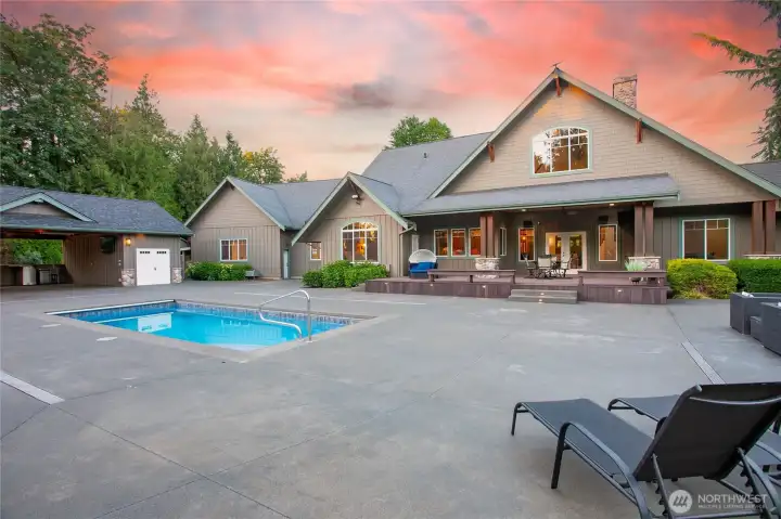 Designed for entertaining, the property boasts more than 5,000 sq. ft. of patio space, an in-ground swimming pool, and a spectacular pool house complete with a stone fireplace, heaters, and bar area—creating a private resort setting ideal for year-round enjoyment. Designed for entertaining, the property boasts more than 5,000 sq. ft. of patio space, an in-ground swimming pool, and a spectacular pool house complete with a stone fireplace, heaters, and bar area—creating a private resort setting ideal for year-round enjoyment.