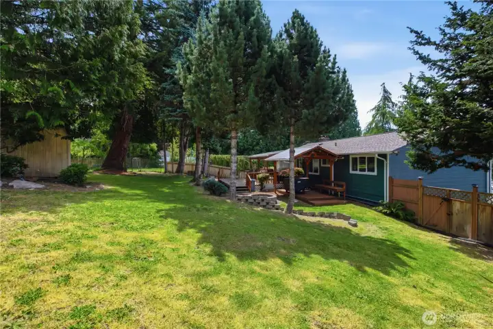 Generous backyard with full fencing for added privacy Generous backyard with full fencing for added privacy