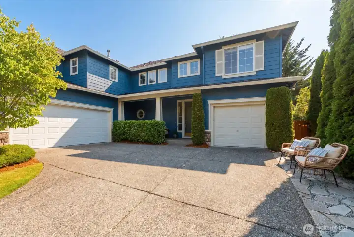 A double garage plus a separate single garage create three total garage spaces, all arranged in a welcoming courtyard layout. A double garage plus a separate single garage create three total garage spaces, all arranged in a welcoming courtyard layout.
