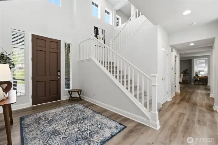 Bright, welcoming entry with abundant natural light and a graceful staircase. Bright, welcoming entry with abundant natural light and a graceful staircase.