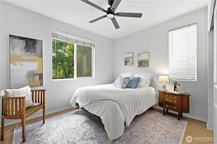Bright main-floor corner bedroom featuring a spacious closet and wonderful natural light from dual windows. This bedroom is located behind the formal living room and next to the main floor full bath - this is Bedroom #1 Bright main-floor corner bedroom featuring a spacious closet and wonderful natural light from dual windows. This bedroom is located behind the formal living room and next to the main floor full bath - this is Bedroom #1