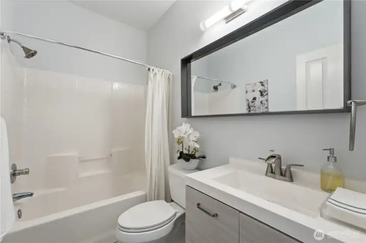 Thoughtfully designed main-floor full bathroom, perfect for guests and ideally positioned beside the main-floor bedroom. Thoughtfully designed main-floor full bathroom, perfect for guests and ideally positioned beside the main-floor bedroom.