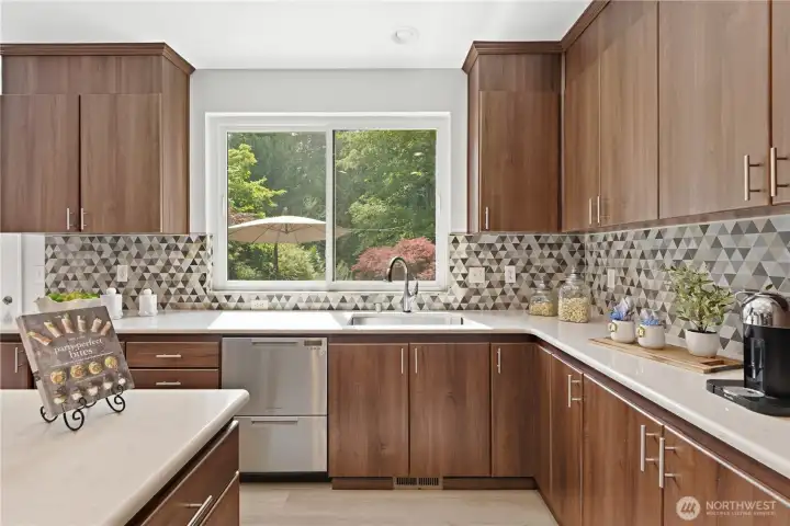 Beautifully updated kitchen with custom tile details, serene backyard outlooks, and a high-end double dishwasher for effortless everyday living. Beautifully updated kitchen with custom tile details, serene backyard outlooks, and a high-end double dishwasher for effortless everyday living.