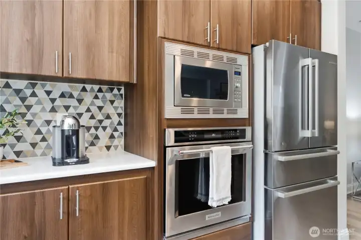 Sleek stainless steel appliances set into rich cabinetry, showcasing the remodeled kitchen’s modern functionality. Sleek stainless steel appliances set into rich cabinetry, showcasing the remodeled kitchen’s modern functionality.