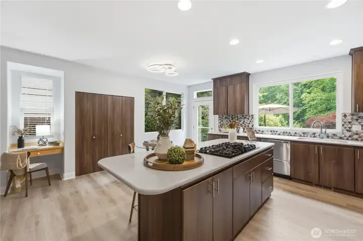Thoughtfully designed kitchen with a spacious pantry, cozy work nook, and plenty of storage to keep everything within reach. Thoughtfully designed kitchen with a spacious pantry, cozy work nook, and plenty of storage to keep everything within reach.