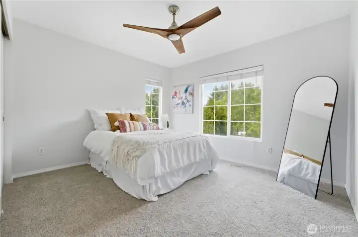 Bright front corner bedroom with large windows and a modern ceiling fan; every bedroom in the home enjoys the same updated fixture. Bedroom #2 Bright front corner bedroom with large windows and a modern ceiling fan; every bedroom in the home enjoys the same updated fixture. Bedroom #2