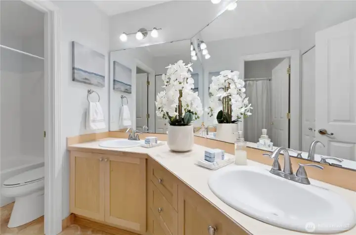 A bright upstairs full bath conveniently located between Bedrooms #2 and #3, offering double sinks and excellent storage. A bright upstairs full bath conveniently located between Bedrooms #2 and #3, offering double sinks and excellent storage.