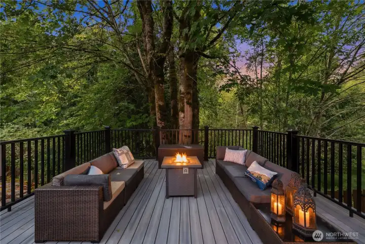 This elevated, newly built deck feels like a tree house overlooking the greenbelt - perfect for those warm, glowing evenings around the fire. This elevated, newly built deck feels like a tree house overlooking the greenbelt - perfect for those warm, glowing evenings around the fire.