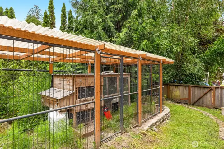 Thoughtfully tucked away, a chicken coop, dog run or garden area is ready for your next project.