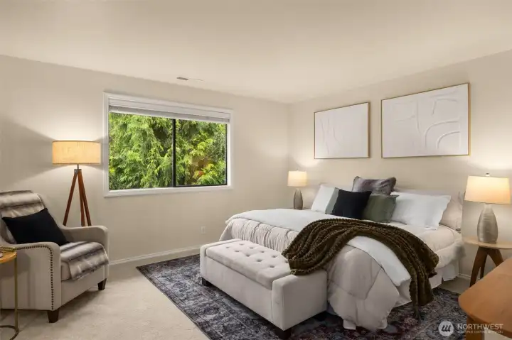 Primary bedroom with en-suite bath and generous walk-in closet.