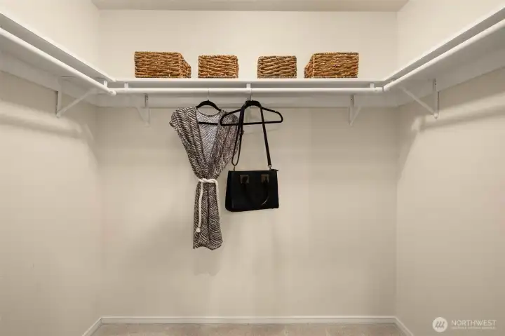 A primary walk-in closet with room to stay organized.
