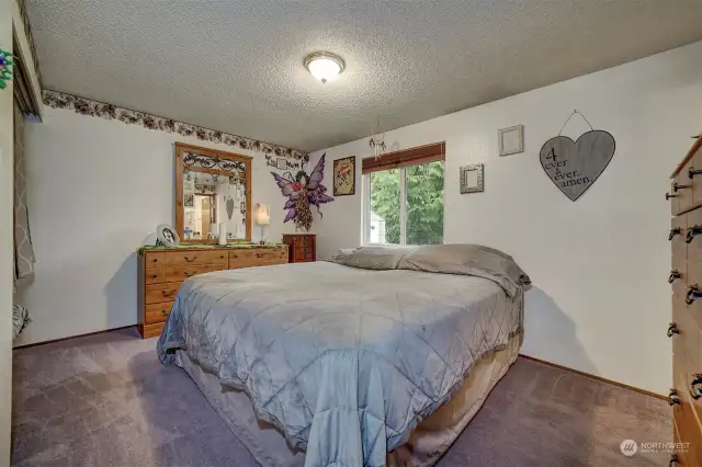 The large principal bedroom is at the back of the home and provides a quiet retreat.