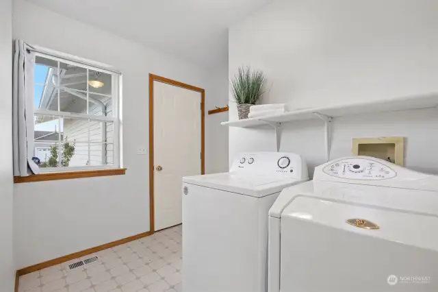 The laundry room is conveniently located off the garage near the entry.