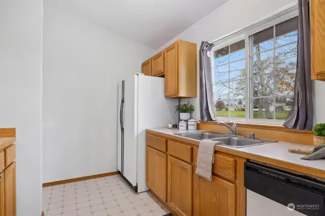 The kitchen looks onto what will once again be a golf course.