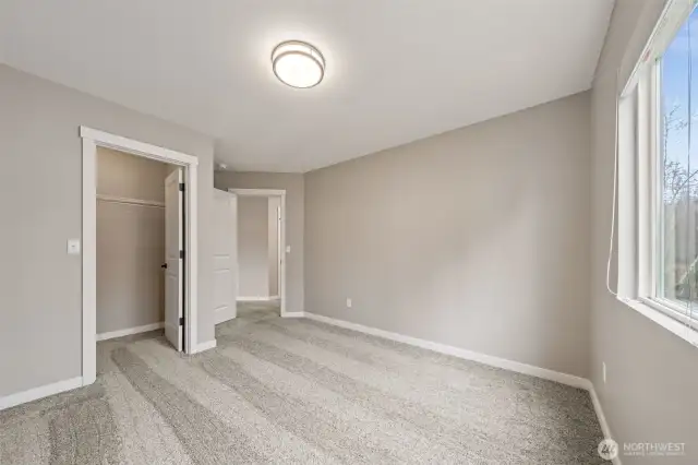 Bedroom # 2 overlooks the front of the home & features a walk-in closet.