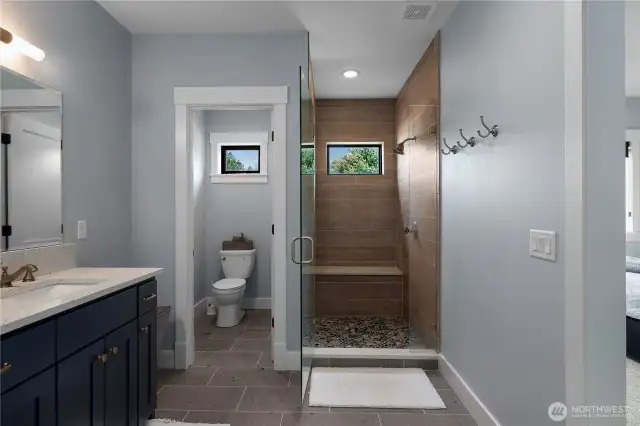 Primary Suite bathroom with plenty of space and beach colors!
