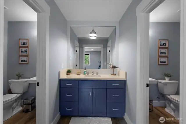 Double bathroom with two 3/4 baths. Cool design and sufficient for multiple people.