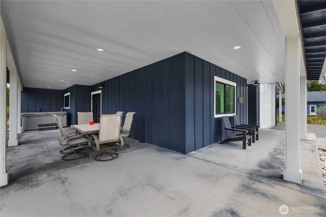 Covered porch area with hot tub. Hot tub may be negotiable. Excellent spot for entertainment!