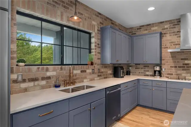 Feel the beach vibes with this color combo of cabinets, counters and backsplash!