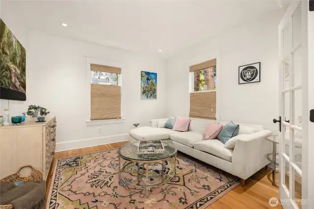 Den off dining area features french doors and fir wood floors.
